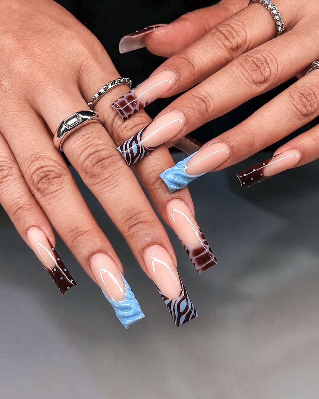 Blue and burgundy mixed design nail set by My Royal Nails & Spa in Humble, TX